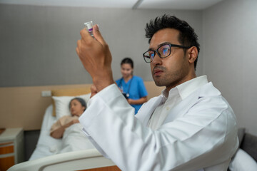 the doctor is injecting insulin for hospital patients