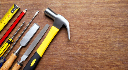 Carpentry tools on wood background with copy space