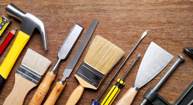 Carpentry tools on wood background