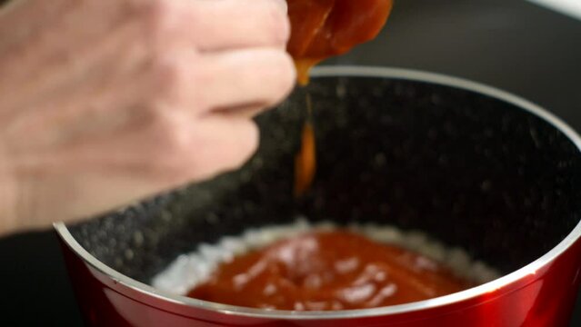 Detail shot, saucepan saut&eacute;ing white onion