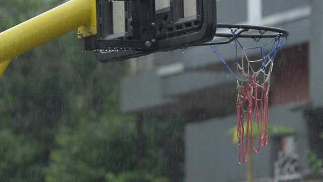 The basketball hoop colse up had been torn by the rain. illustration of a sport that is experiencing a decline in performance.