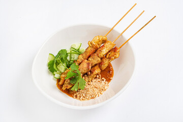 Grilled chicken kebabs with vegetables and sauces.