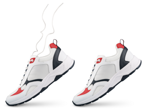 White sneaker with flying laces stands on the tip isolated on transparent background