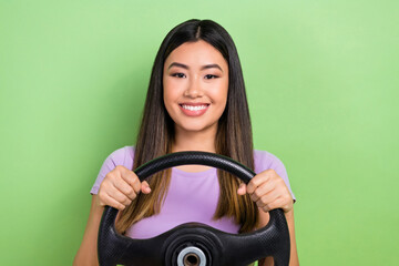 Photo of satisfied chinese girl hold steering wheel driving optimistic automobile no panic keep...