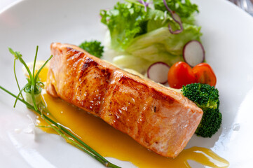 Experience the perfection of Pan-Seared Salmon: crispy, moist, and bursting with flavors. Indulge in this culinary masterpiece and elevate your dining pleasure.