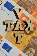 VAT, Tax, words and euro banknotes