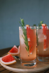 Pink Paloma cocktails with grapefruit juice, tequila and rosemary.