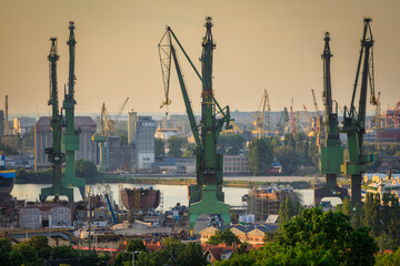 Cranes of the shipyard in Gdansk at sunset, Poland