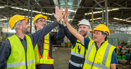Group of colleague Engineer team join stack hand together with Spirit diversity solidarity power team in factory. foreman Join hand show oneness unity together teamwork friendship empower.