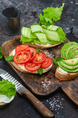 Sandwiches with tomato, avocado and cucumber
