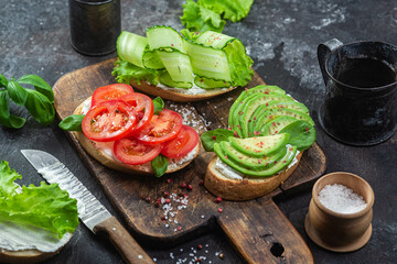 Sandwiches with tomato, avocado and cucumber