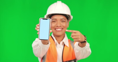Architect woman, phone and point by green screen with smile on face for logo, app or thumbs up in mockup. Female engineer, architecture or sign for choice, review or vote in real estate construction