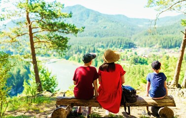 family on the bench on the hill