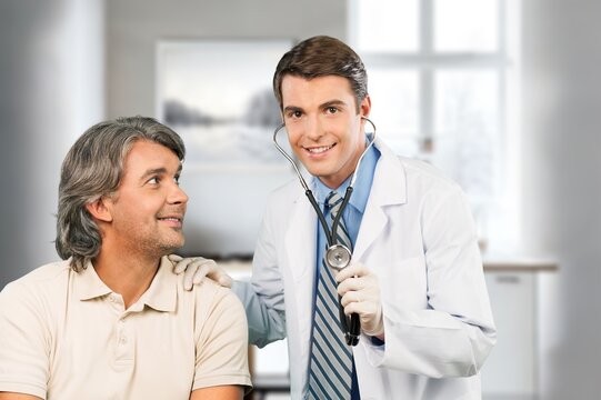 Caring young doctor examine patient
