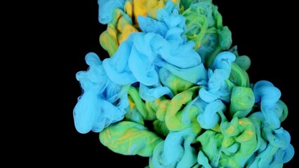 Colorful Blue and Green paint drops from above mixing in water. Ink swirling underwater. Cloud of silky ink isolated on black background. - Powered by Adobe