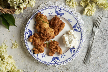 Fried European elder flowers. Foraging concept.