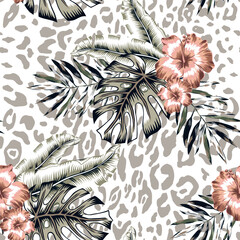 Tropical hibisus flowers, monstera palm leaves, leopard spots animal print background. Seamless pattern. Vector illustration. Exotic plants. Summer beach floral design © ojardin