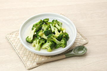 Stir fried broccoli or ca brokoli, Indonesian food, served in a bowl.
