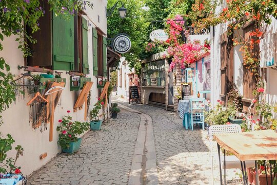 Izmir, Sigacik / Turkiye - June 20 2023: Sigacik streets, seaside town, quiet summer holiday, flowery streets, Seferihisar, Izmir, Turkey
