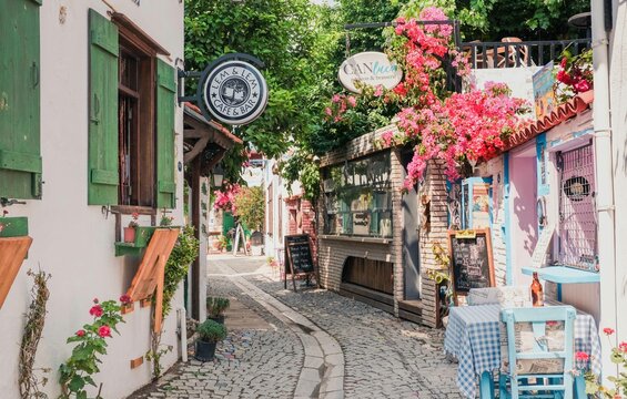 Izmir, Sigacik / Turkiye - June 20 2023: Sigacik streets, seaside town, quiet summer holiday, flowery streets, Seferihisar, Izmir, Turkey
