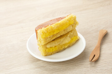 Kue Pukis with pineapple jam, made from flour, yeast, egg, sugar and then baked. Indonesian traditional food
