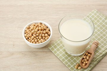 Susu Kedelai, glass of soy milk on wooden table
