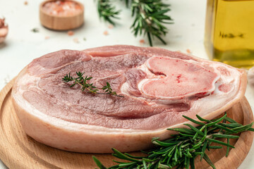 pork leg on a wooden background, banner, menu, recipe place for text, top view