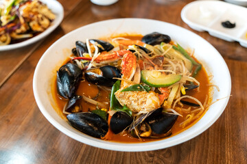 Delicious jjamppong, jjambbong, Chinese-style Korean noodle soup topped with spicy seafood and...