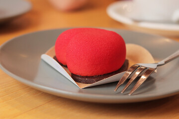 Pink heart shaped cake. Dessert for Valentine's Day. Cake in a cafe