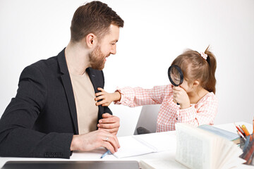 Girl with Down syndrome studying with her teacher at home