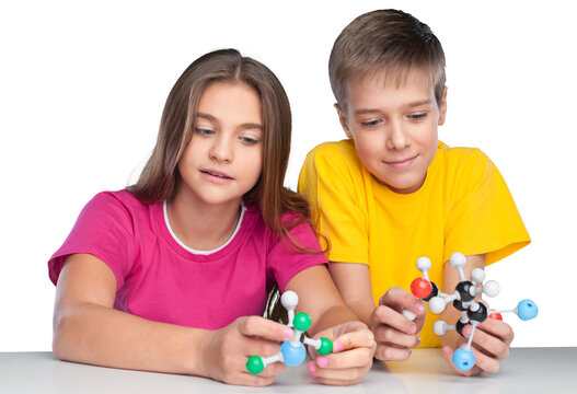 Two School Children Holding Molecular Model - Powered by Adobe