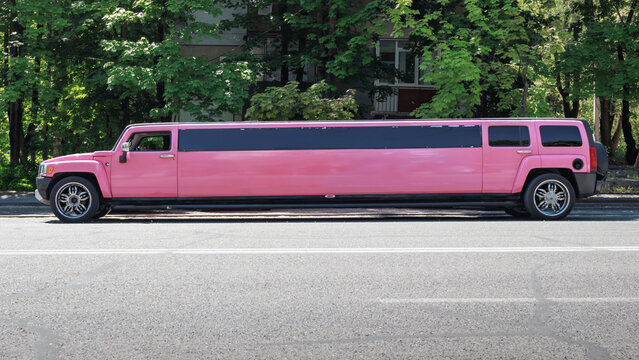 Hummer H3 stretch limousine, side view, pink colored