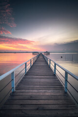 Wooden jetty on the sea at beautiful sunset, Indonesia