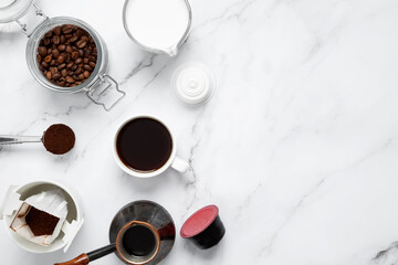 Ingredients for making coffee. Different ways to make coffee metal cezve, coffee machine capsules, drip and milk. Coffee making concept. Flat Lay. Top view. Copy space