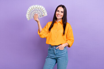 Portrait of peasant adorable woman with straight hairdo wear oversize shirt hold money win jackpot...
