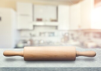 New wooden cooking rolling pin on desk