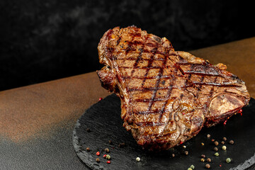 Grilled beef steak medium rare on a dark background. Long banner format. top view