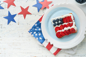 4th of July American Independence Day food. American flag sandwich with strawberries, blueberries,...