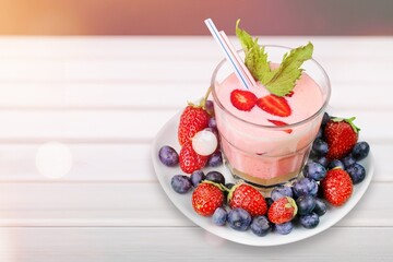 Delicious berry smoothie drink in glass.