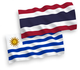 Flags of Oriental Republic of Uruguay and Thailand on a white background