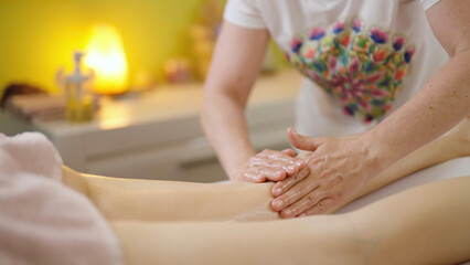 Obraz na płótnie Canvas Revitalizing Legs Massage at a Professional Salon