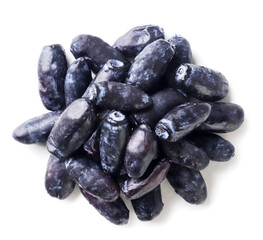 Heap of honeysuckle berries on a white background. Top view