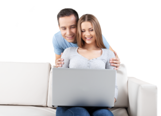 Smiling Couple Using Laptop on the Couch