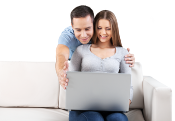 Smiling Couple Using Laptop on the Couch