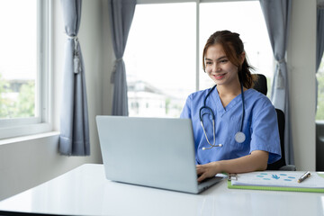 Experienced female doctor with stethoscope working on laptop on treatment information Medicines and human body parts concept of modern medical services.