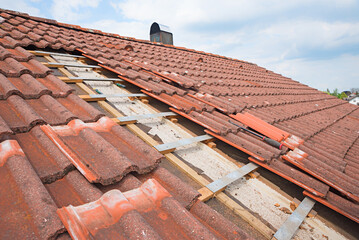 uncovered roof, broken shingles to replace after a storm damage