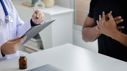 Fototapeta premium The doctor and the patient are discussing the details of the treatment, the results of the physical examination of the patient. Annual physical examination concept.