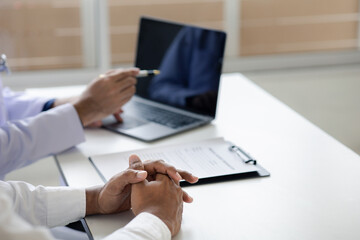 The doctor and the patient are discussing the details of the treatment, the results of the physical examination of the patient. Annual physical examination concept.