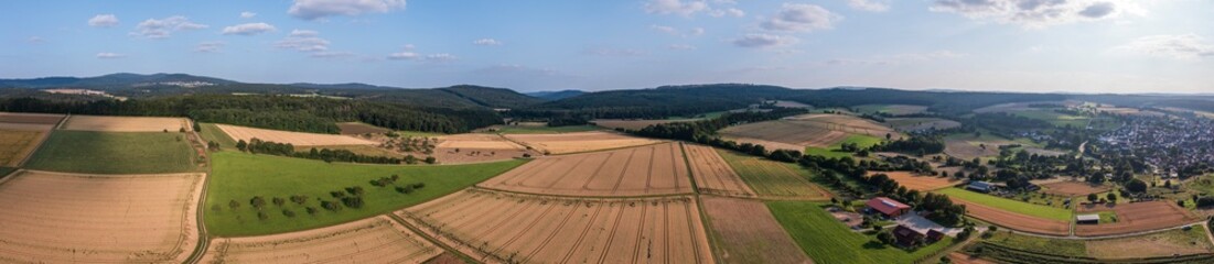 Fototapeta na wymiar Bird's-eye view of a summery landscape in the Taunus/Germany with grain fields