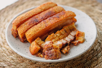 crispy fried pork belly in a plate
